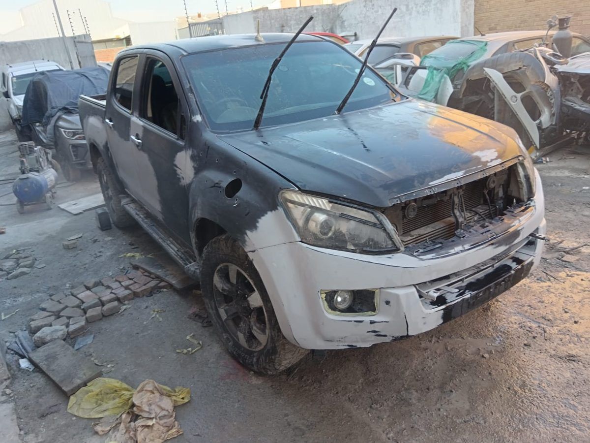 Isuzu bakkie with damaged panels before repair