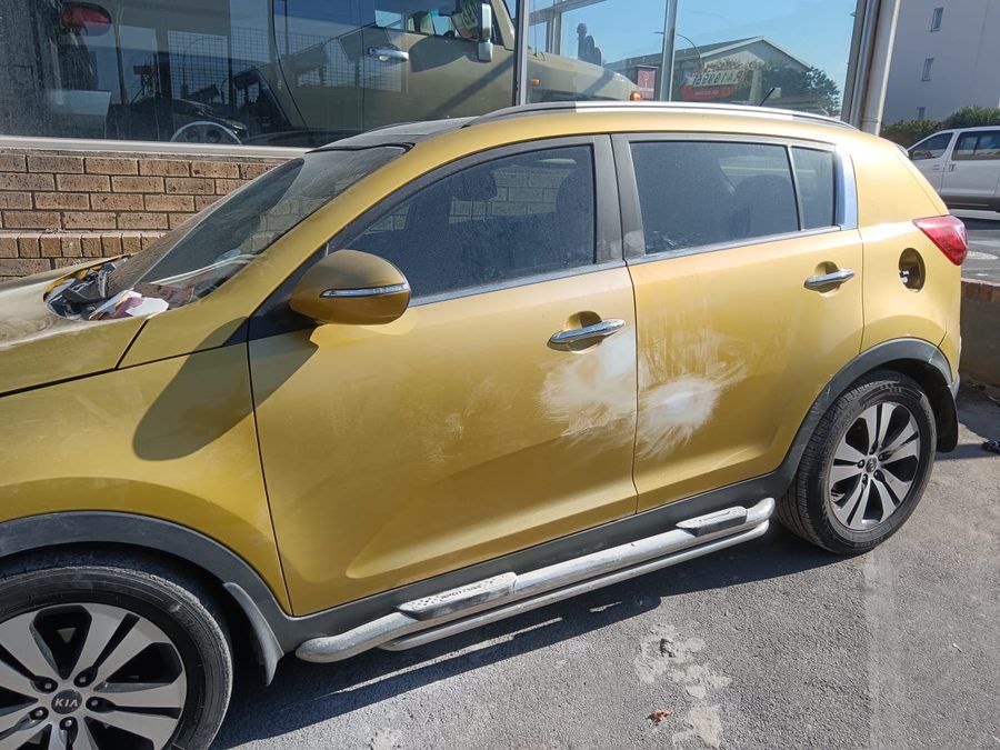 Kia Sportage door damage before repair